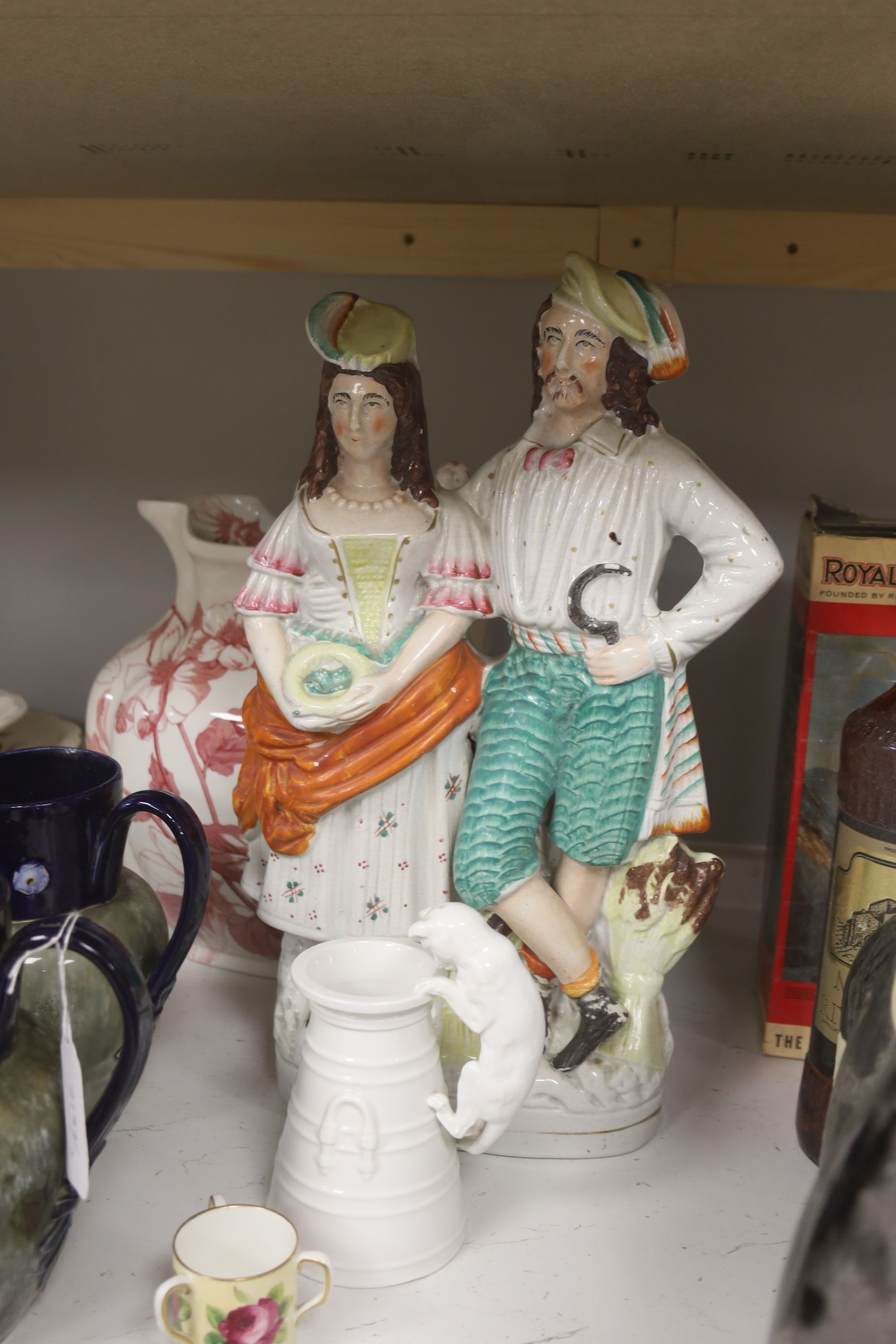 A pair of Doulton commemorative jugs, cat pail, miniature tyg and Staffordshire flatback, 40cm